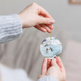 Load image into Gallery viewer, Christmas Day Skate Date Watercolor Ceramic Ornament
